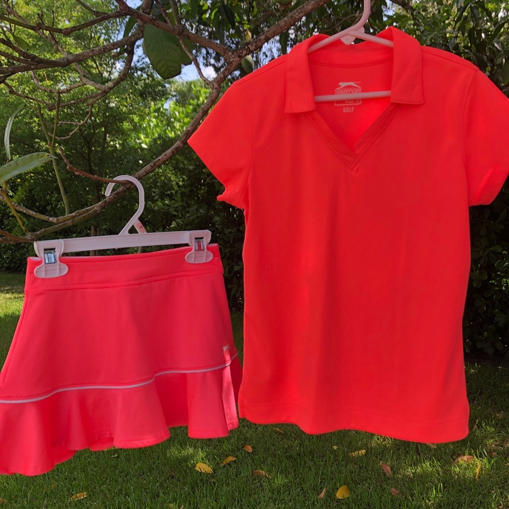 Two girls golf/tennis outfits.